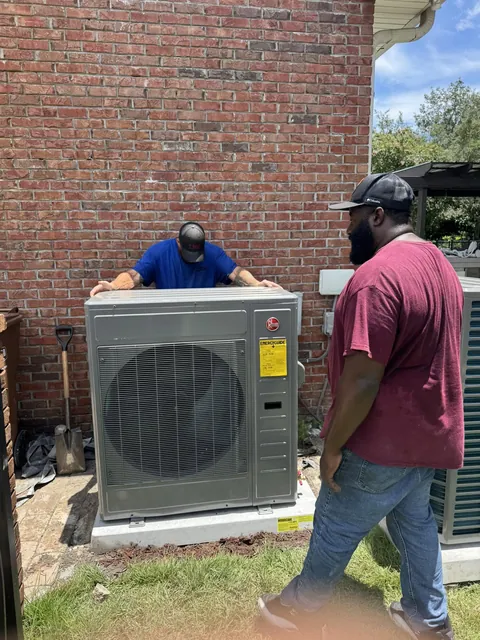 New heat pump condenser installed beside a Florida home after replacement