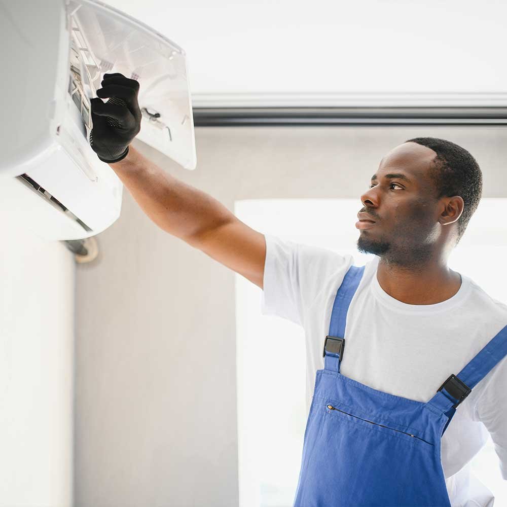 Technicians installing a new residential air conditioning system