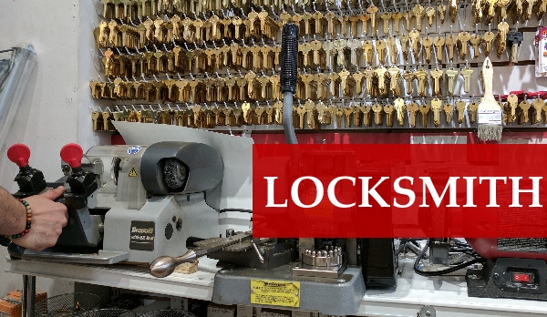 Locksmith installing a deadbolt lock on an apartment door in Manhattan
