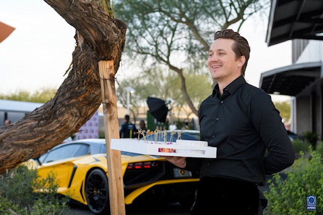 Passed hors d’oeuvres beside a Lamborghini on the runway
